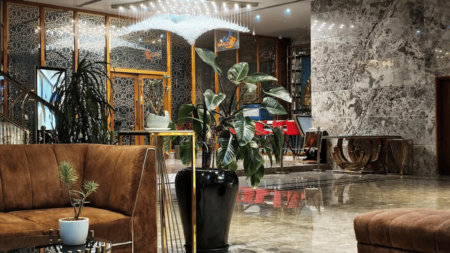 The common seating area in the lobby with elegant marble flooring at Leroy Grand, Yeshwanthpur.