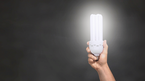 a person holding an LED light 