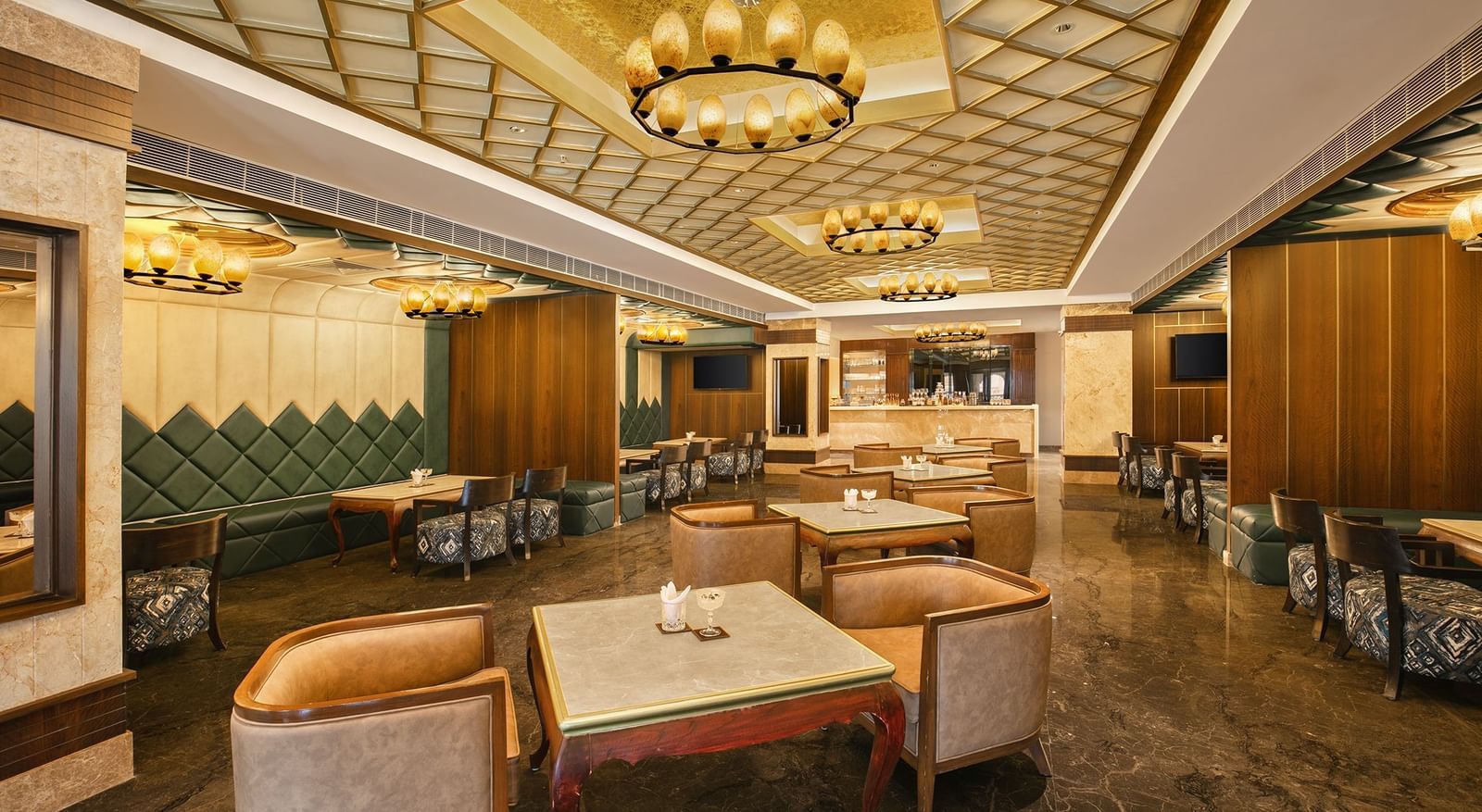 An upscale bar in Mahabalipuram with contemporary interiors and golden accents - Kaldan Samudhra Palace