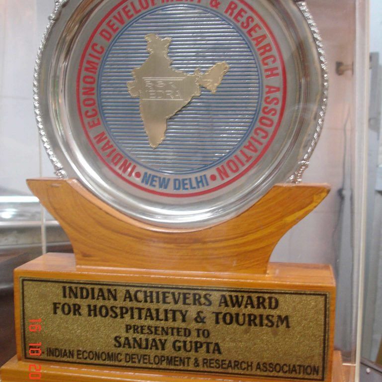 An award which reads, 'Indian Achievers Award for Hospitality & Tourism'. - Hotel Ashok Nagpur