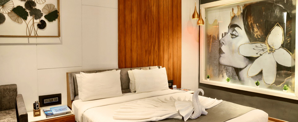 Premier Room, Bed against the wood-panelled wall
