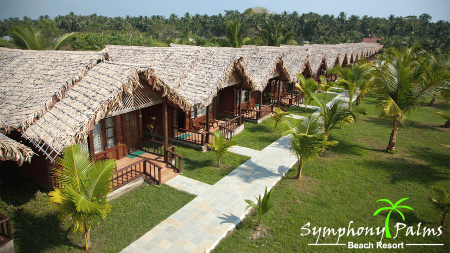 Cottages with thatched roof at Symphony Palms Beach Resort And Spa, one of the finest 5-star luxury resorts in Havelock Island.