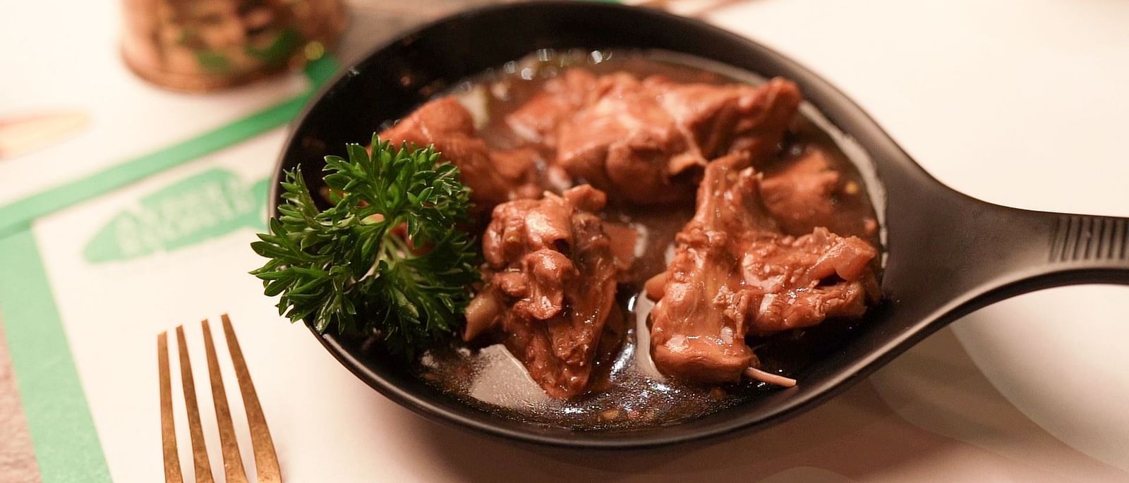 An image of a chicken soup served in a bowl - Pai Group of Hotels