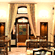 Hotel Devnadi, Haridwar | A dining space with chairs, tables, and a fan.