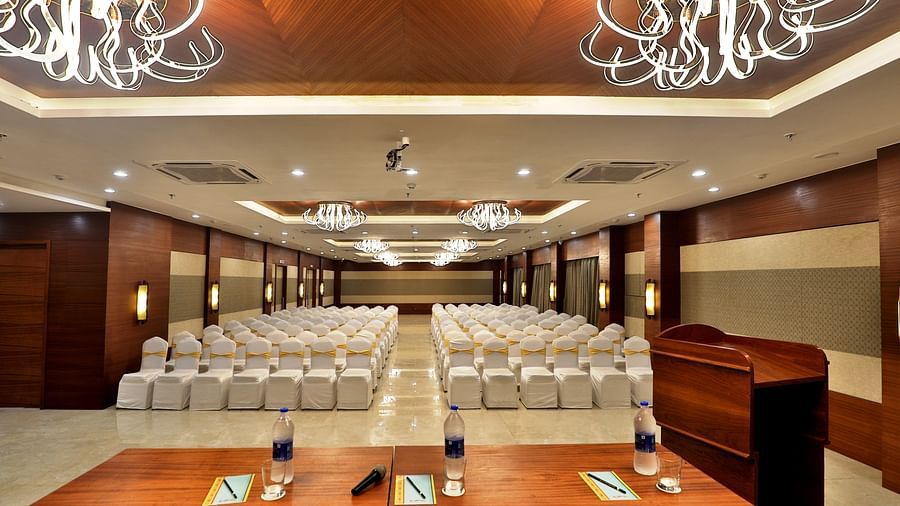 Theatre style seating arrangements with a desk on the podium inside the Banquet hall - VITS Devbhumi, Dwarka