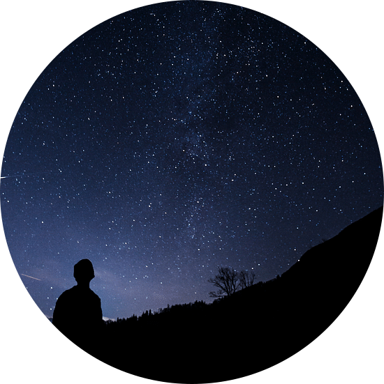 silhouette of a person stargazing