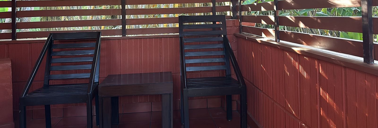 view of a verandah with chairs kept in shade - Kadkani River Resort, Coorg