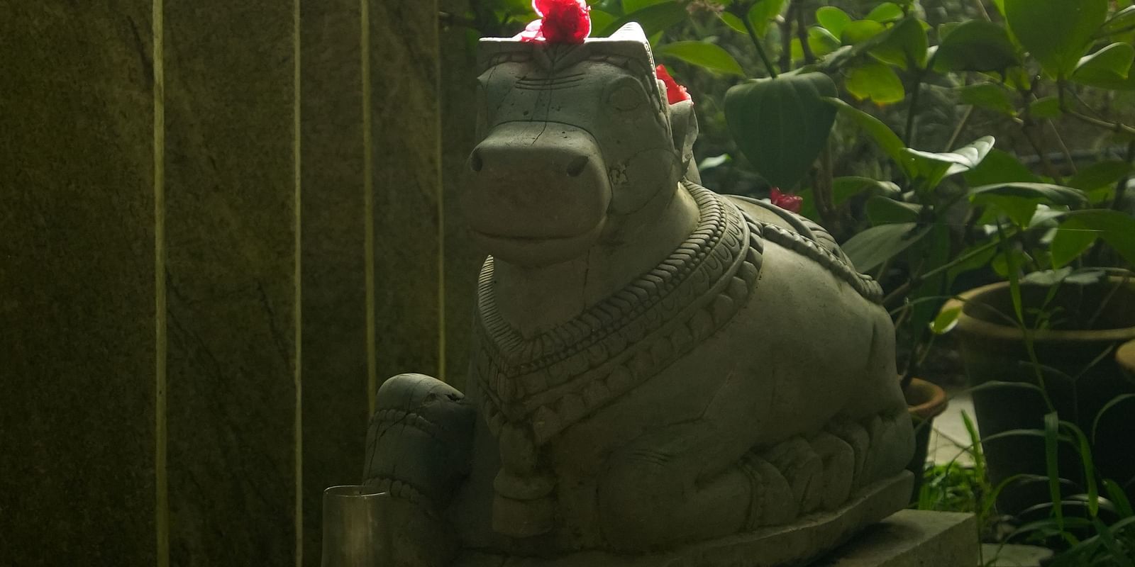 image of a stone sculpture of nandi at hoysala vilage resort, hassan