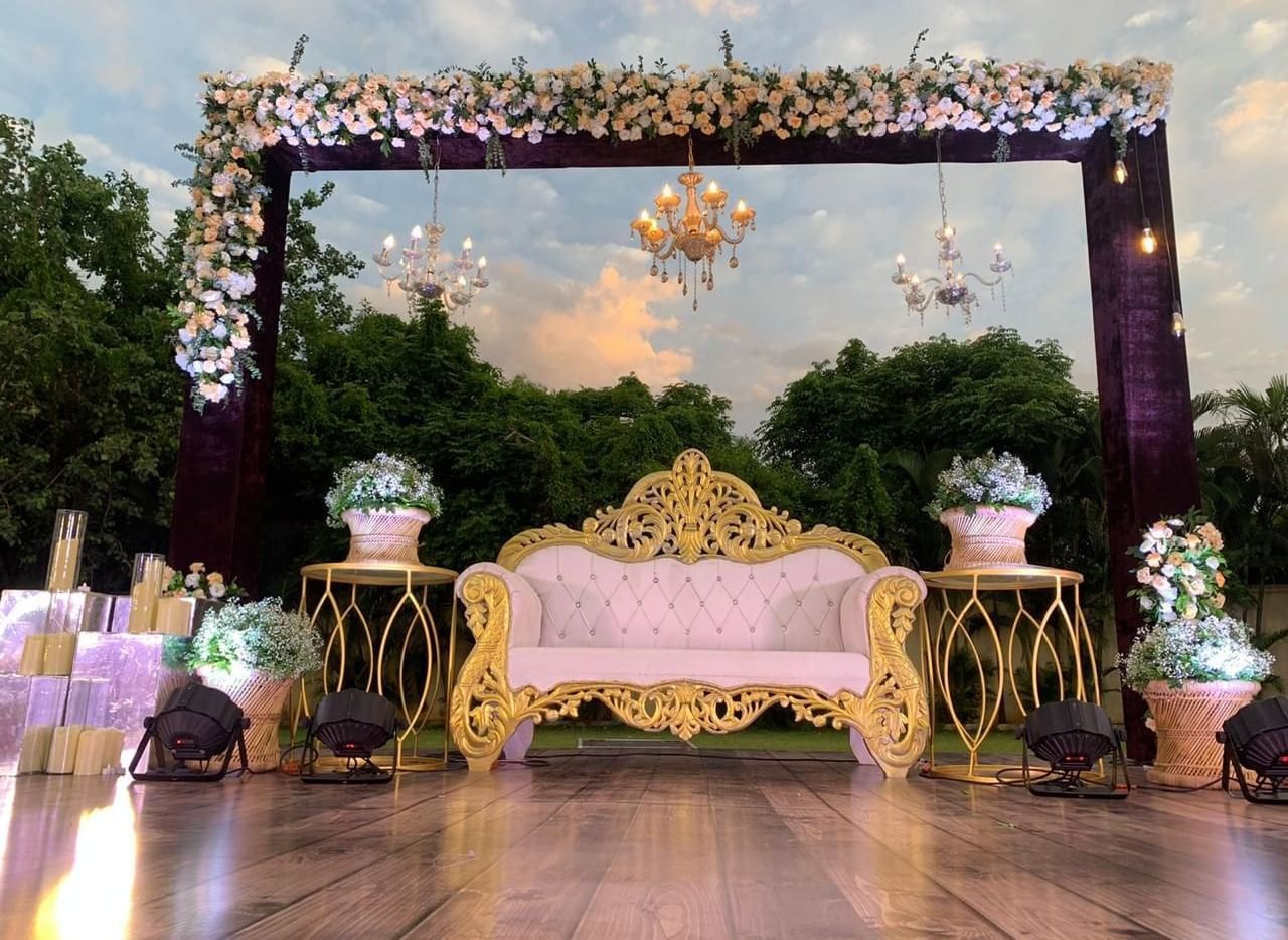 Stylish evening stage arrangement with intricate floral decor at Ilara Hotels & Spa, OMR, Chennai