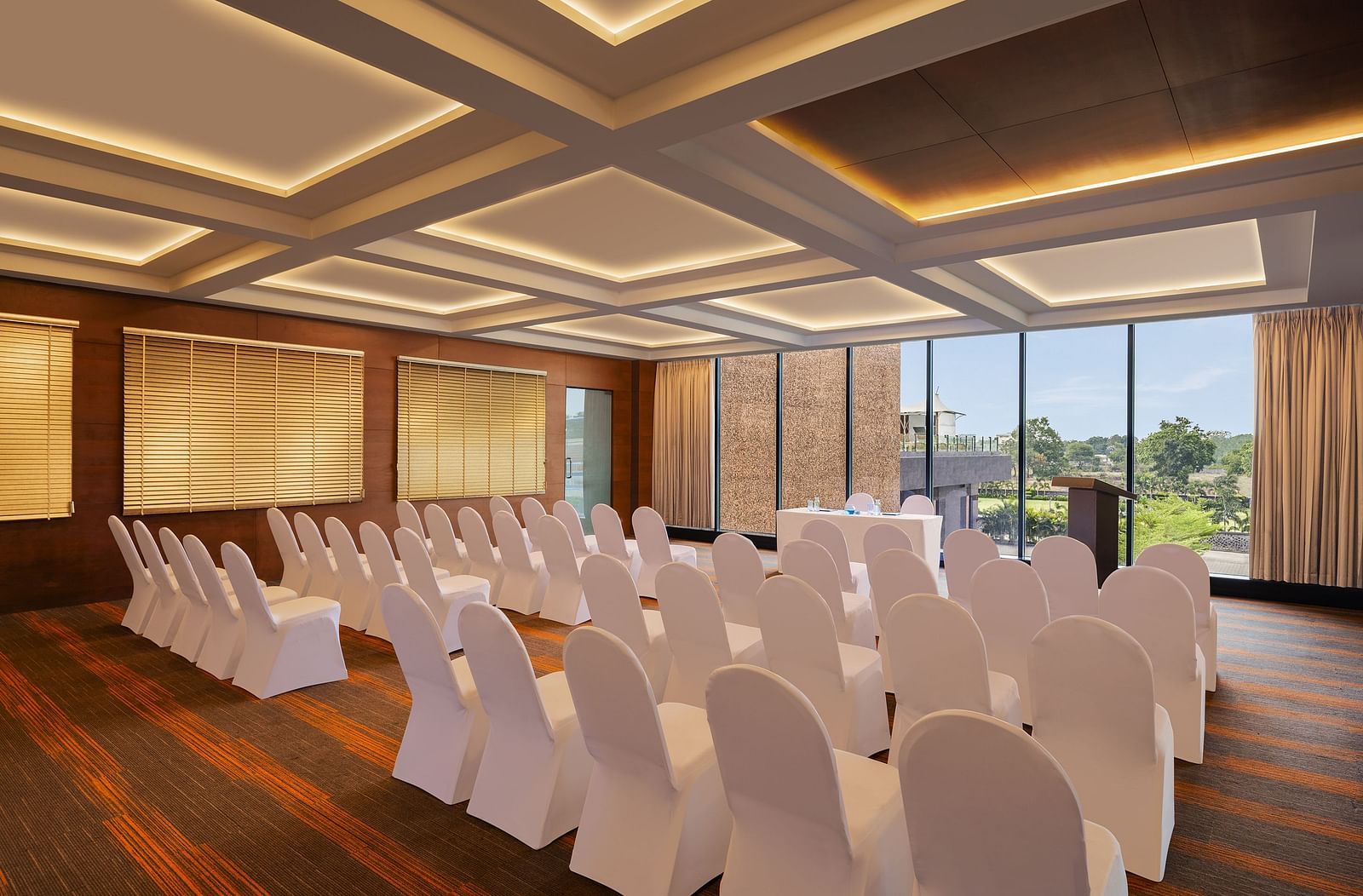 Carnival Hall at Essentia Luxury Hotel, Indore with large windows and a conference arrangement