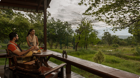 couple enjoying a meal on the balcony of one of our rooms at The Serai Bandipur