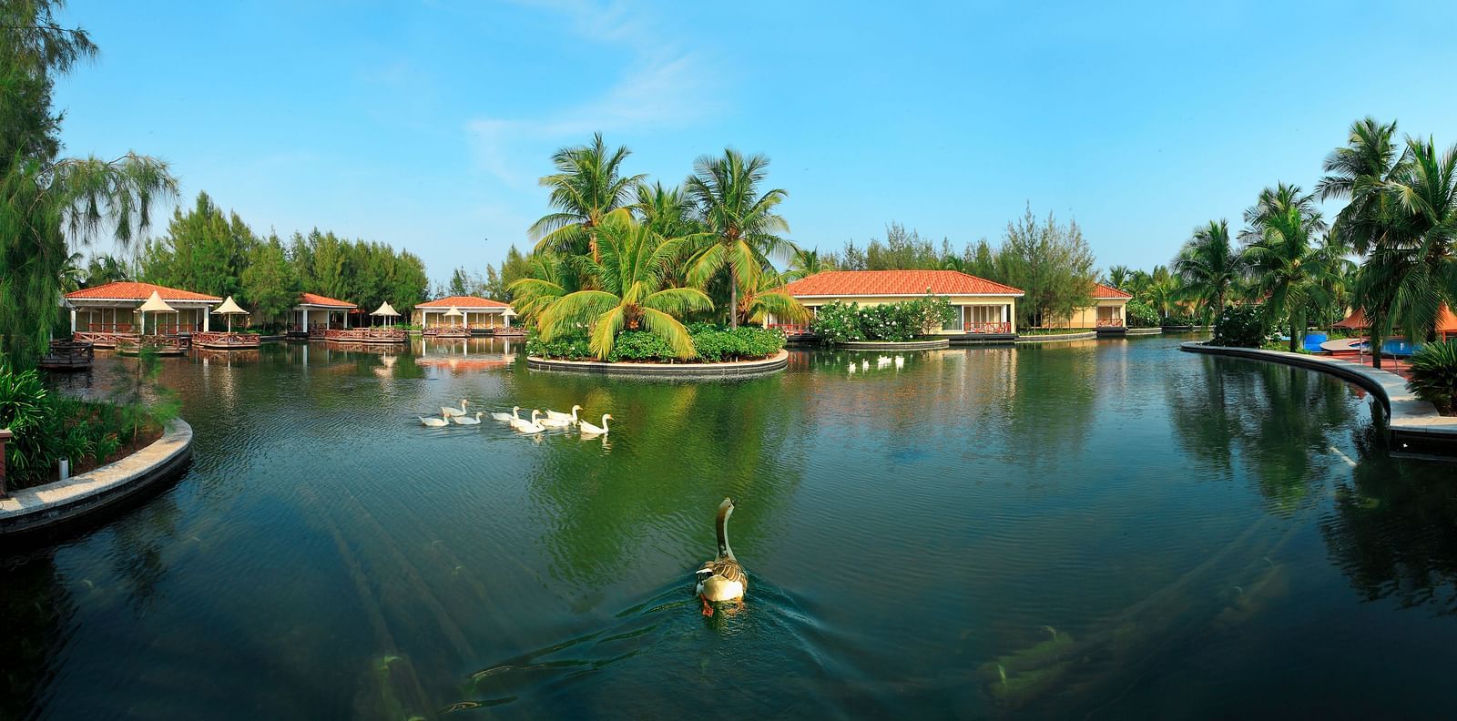 View of Guadeloupe Exterior with a lake in the foreground at Ocean Spray, Pondicherry
