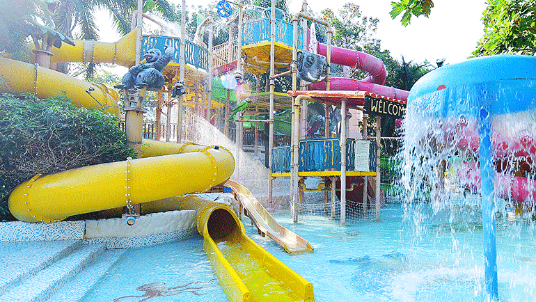 Water Kingdom - View of WATERFALLS UMBRELLAS ELEPHANT-TILTING-BUCKET at our water park during daytime