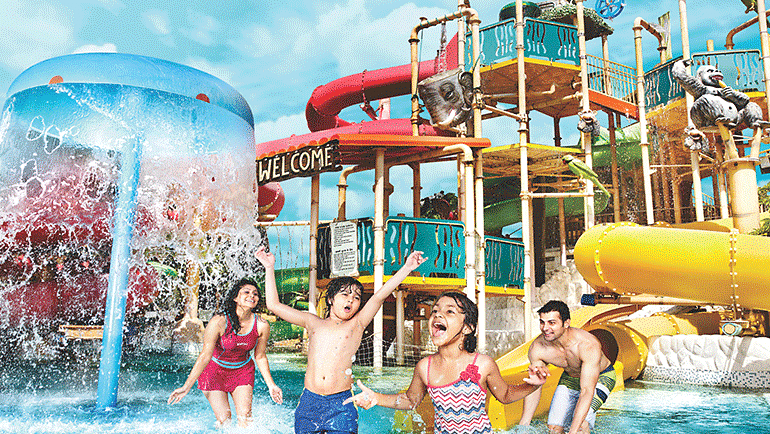 Water Kingdom - a group of children playing in the water at daytime