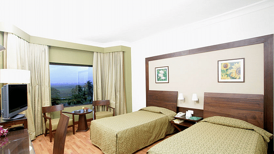 twin beds in the Deluxe Room at The Retreat Hotel and Convention Centre Madh Island Mumbai