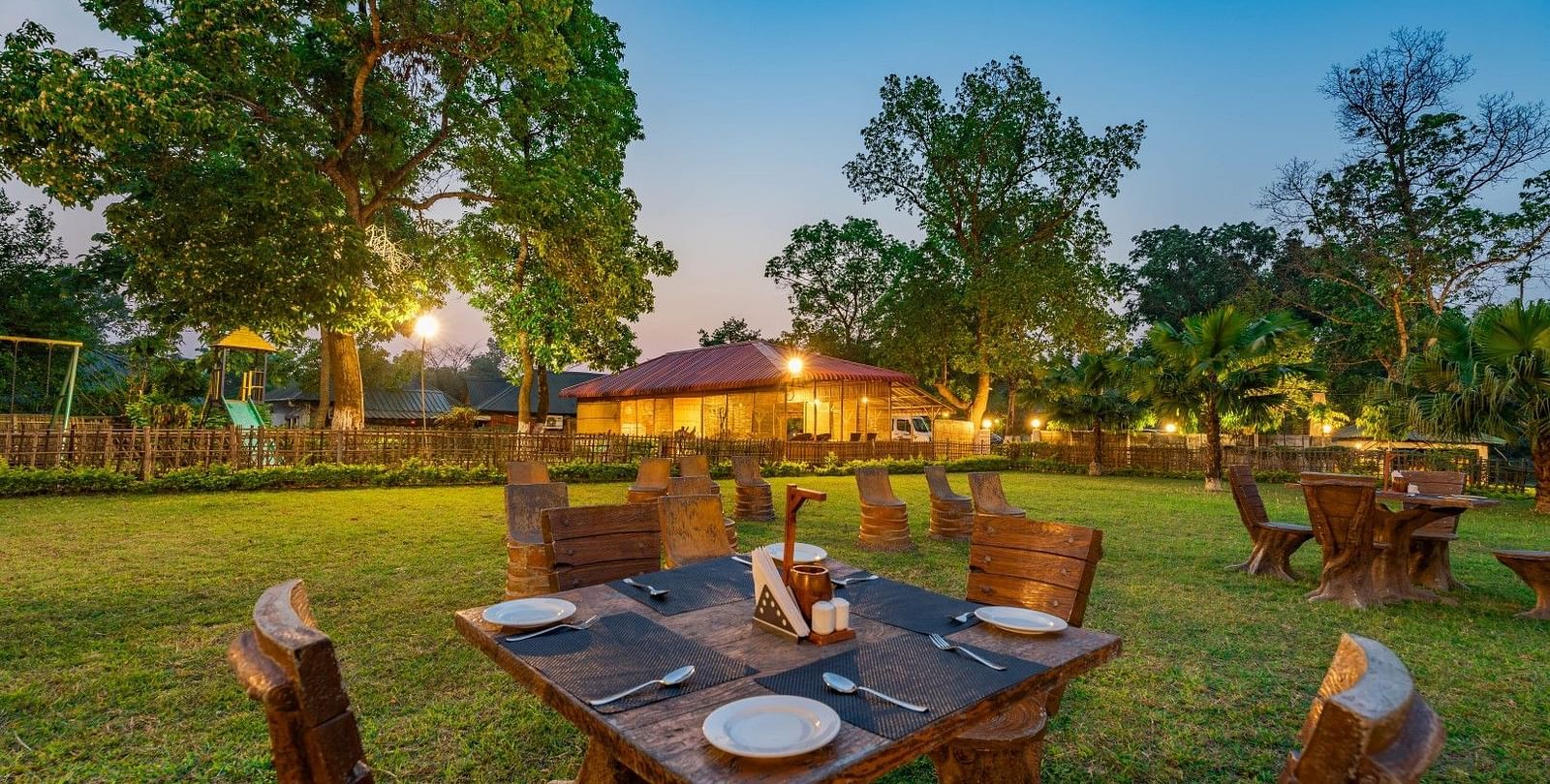 Outdoor dinning at Summit Green Lake Tea Resort & Spa, Kaziranga