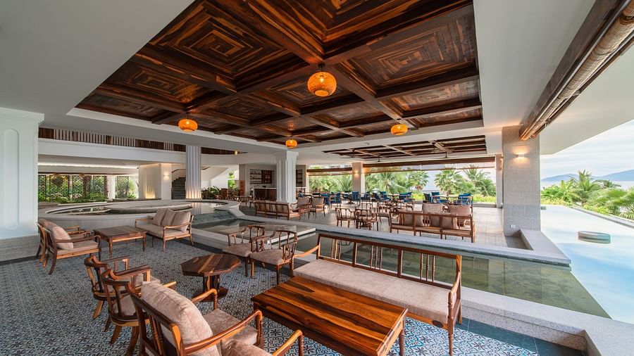 An image of a huge sitting area of with several chairs and centre tables - Alibu Resort Nha Thrang
