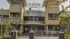 Close-up of hotel exterior signage and entrance gate at VITS Lonavala.