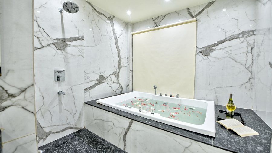 a spacious bathroom with a bathtub 
