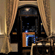 A room with tables, chairs, lights, and a window. | Hotel Devnadi, Haridwar