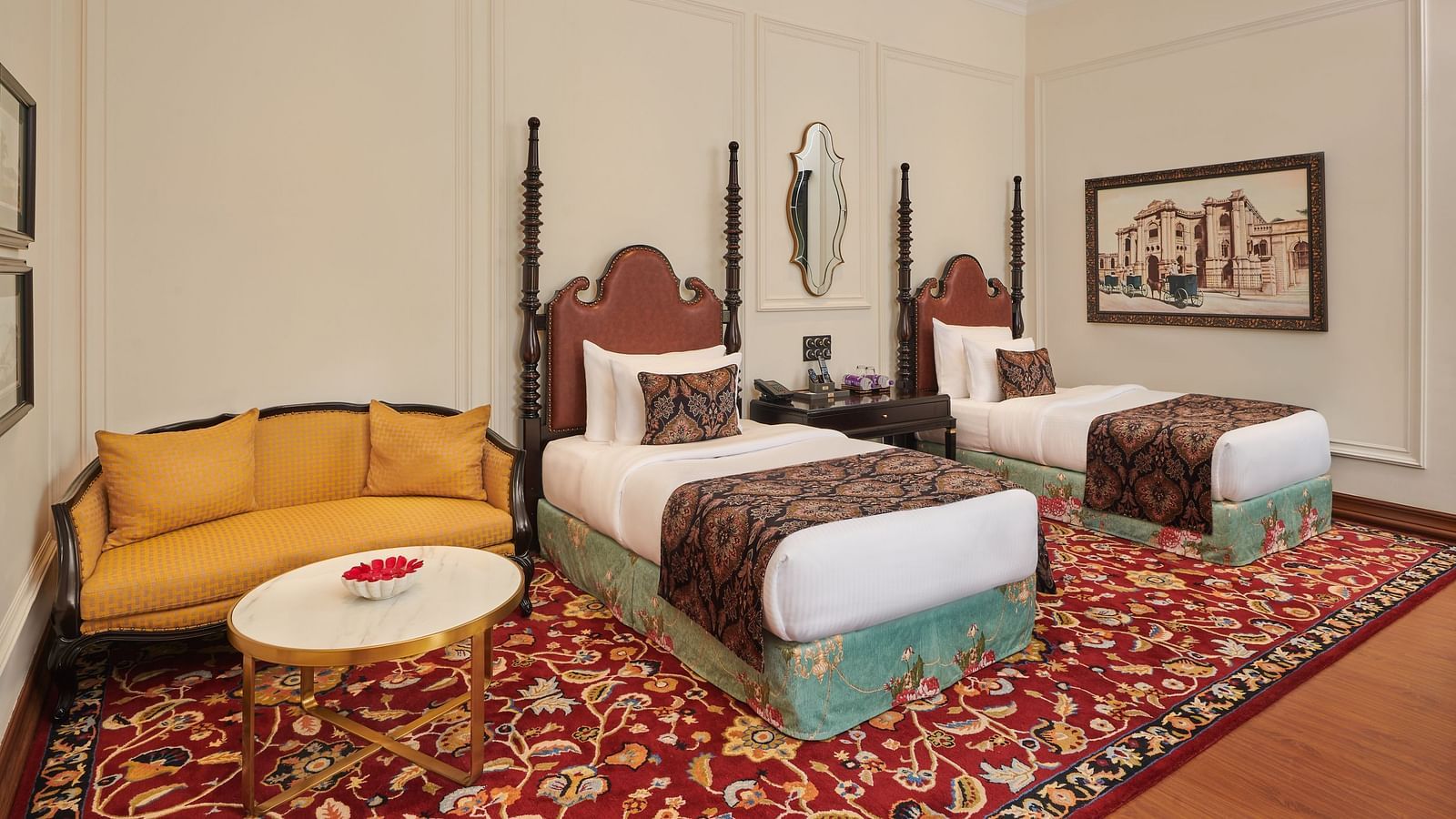 Twin-bed room with elegant decor and vintage artwork at MAYFAIR Tea Resort, Siliguri