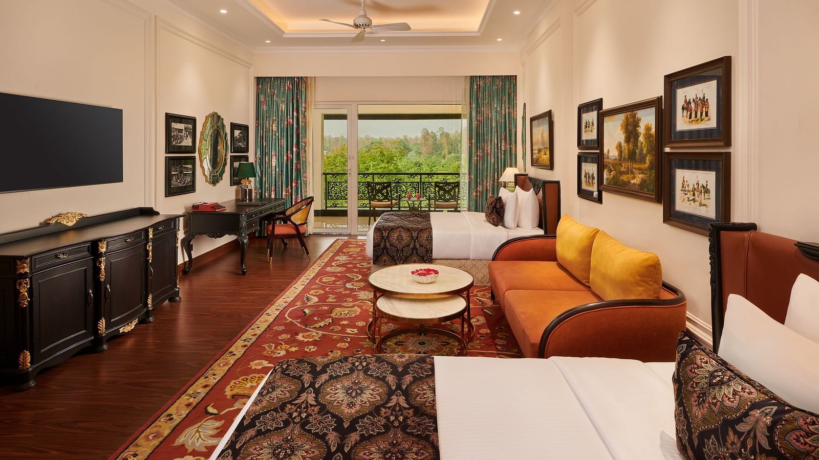 Elegant suite with twin beds, flat-screen TV, and balcony view at MAYFAIR Tea Resort, Siliguri