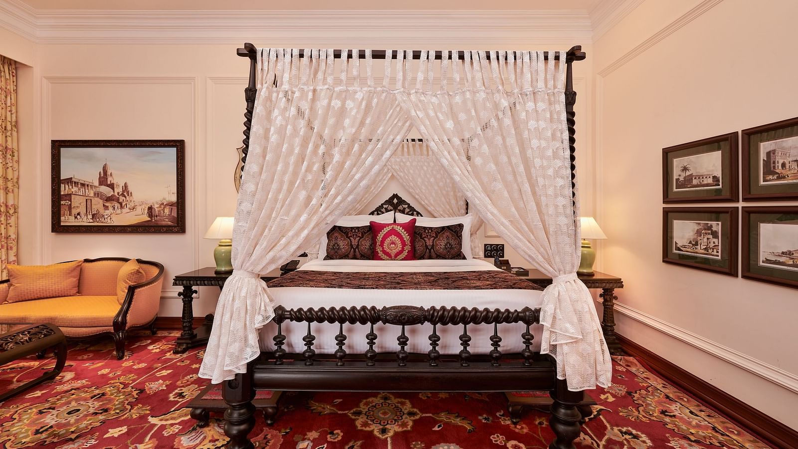 Classic four-poster bed in a richly decorated suite at MAYFAIR Tea Resort, Siliguri