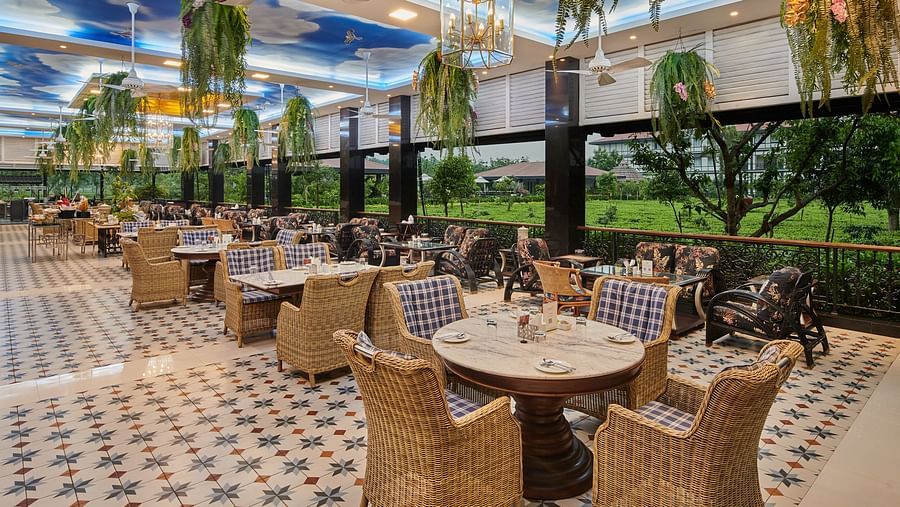 indoor seating space at tea pot - Mayfair Tea Resort, Siliguri 1