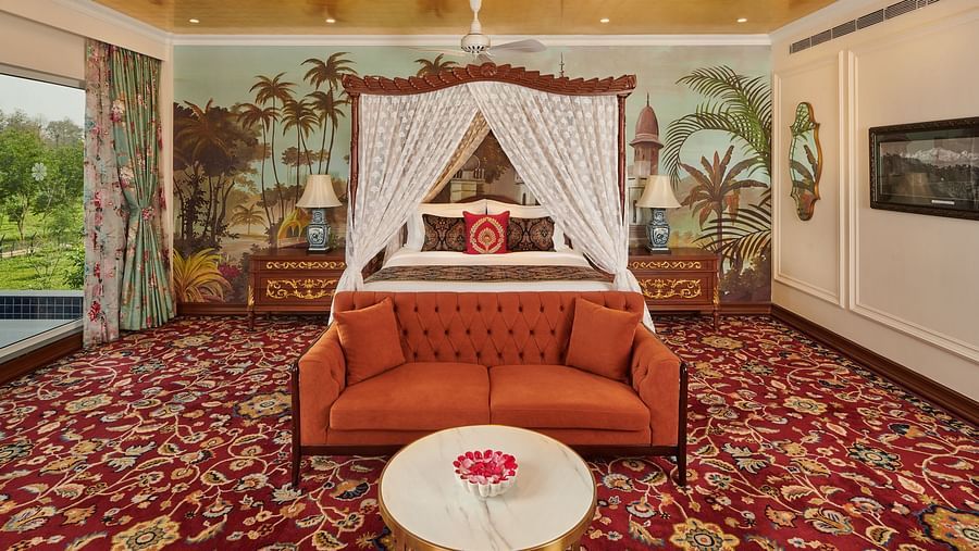 Canopy bed in a royal themed suite with garden views.
