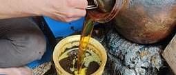 A close up shot of a person pouring tea