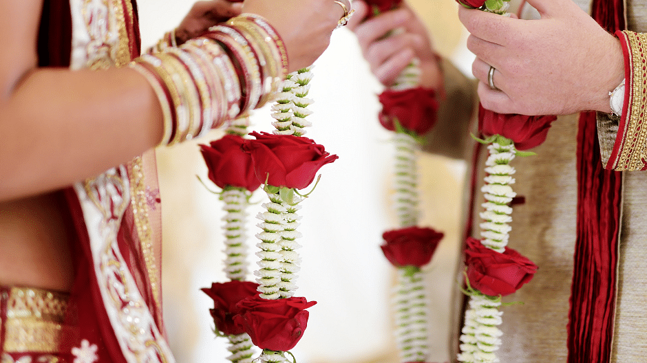 An image capturing a close-up of an Indian wedding ritual.