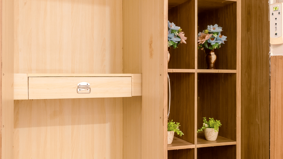 Deluxe Room at Hotel Corporate Suites featuring a pair of bath slippers and a couple of hangers in a wardrobe