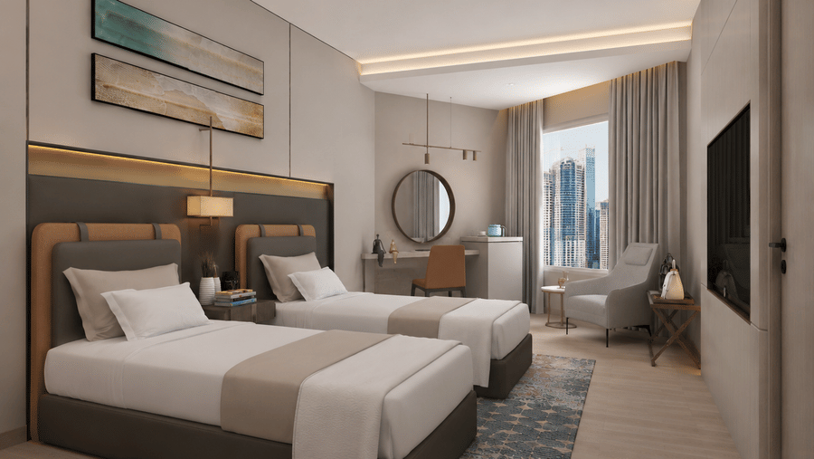 Twin bedroom at Tulip Inn Bidar featuring 2 single beds, bedside table, 2 wall artworks, a dressing desk with a mirror, armchair, and wall television.