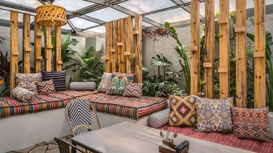 Cosy seating arrangements with cotton mattresses and glass ceiling at Village 36
