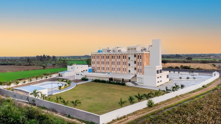 bird's eye view of The Orchid Hotel, Jamnagar with evening sky in the background
