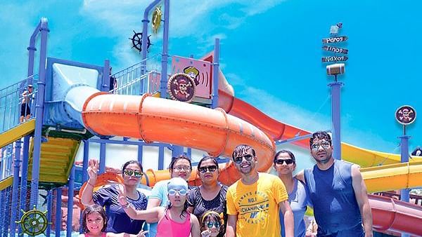 A group of people in front of a water park - Diamond Parks, Pune 