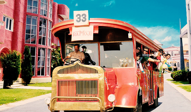 Backlot tour by red vintage bus - Ramoji Film City