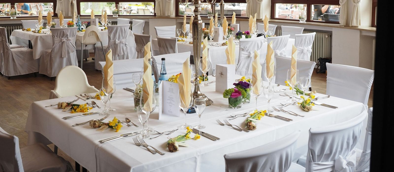 A beautifully decorated Banquet Hall, adorned with elegant lighting, floral arrangements, and festive décor, setting the perfect atmosphere for celebration