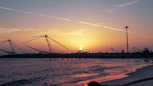 A view of the Chinese Fishing Nets from Munambam Beach in Kochi, A Famous Beach in Kochi.