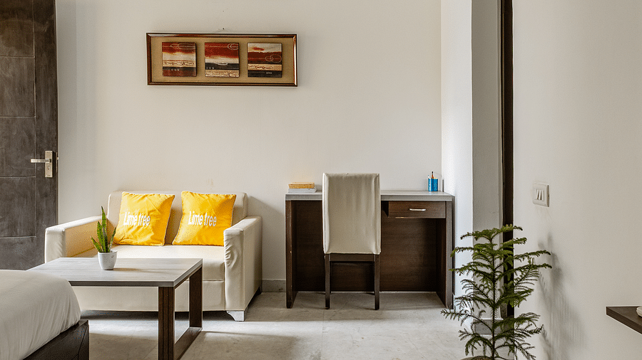 Room view with a corner table and a sofa seating at Lime Tree