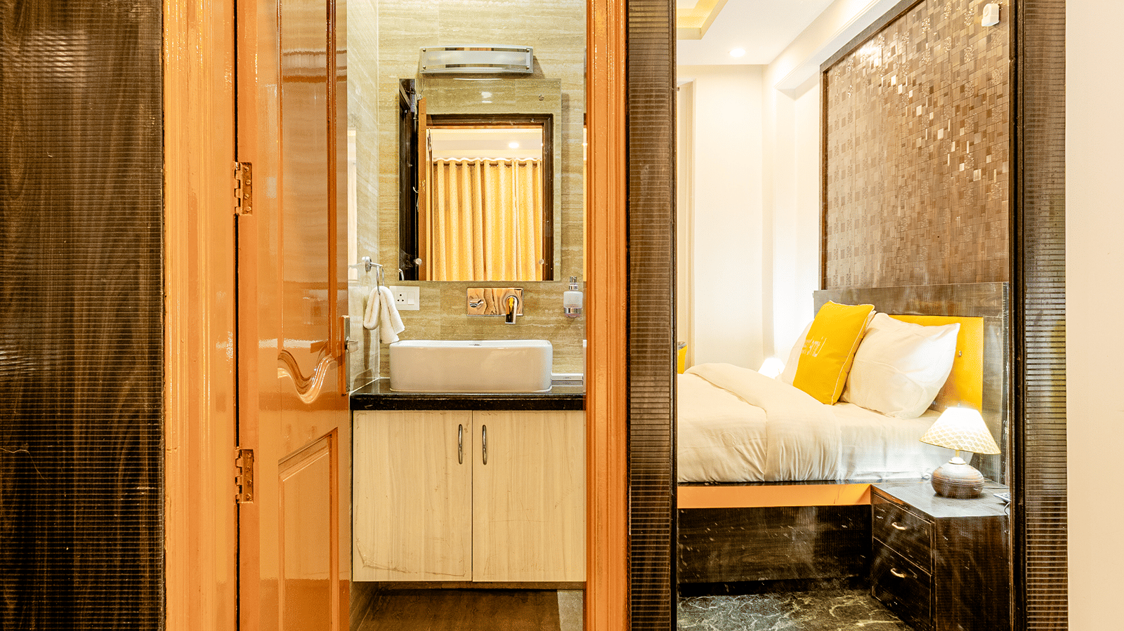 Entrance to a modern hotel bathroom connected to the  room.