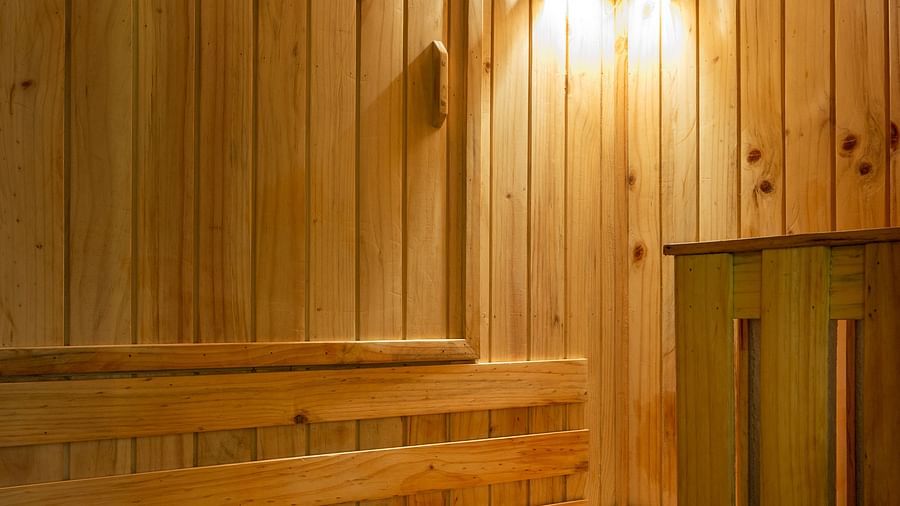 Image of a room with a wooden bed and wooden interior at Calux Grand Baga.