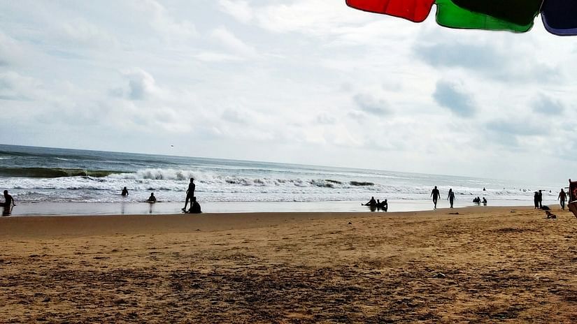 An image of a beach where people are seen enjoying themselves