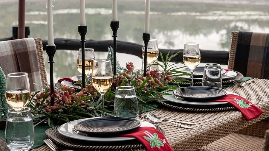 Closeup of the dining setup at Swimming Pool at Saccharum Safari Lodge, Balaghat