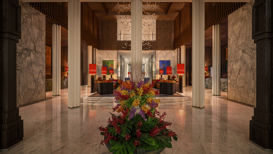 Lobby featuring marble pillars and a floral arrangement centerpiece at The Residency Signature Madurai.