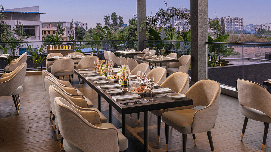 A view of dining area at Citron Bar with comfortable seating at Essentia Premiere, Pune.