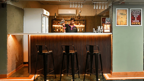 bar counter with stools in front of it inside MEZZE9 Bar Kitchen 21 - VITS Sharanam, Thane
