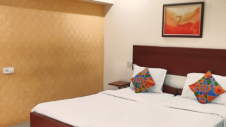 Spacious Executive Room at Udipi Home with double bed and modern decor