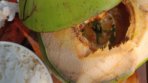 daab chingri inside a tender coconut