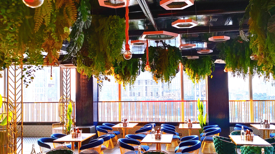 Full view of Kensho rooftop pub at Leroy Grand, Yeshwanthpur, with hexagonal modern lamps hanging from the ceiling.